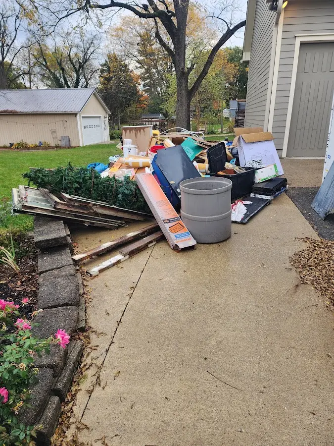 Dumpster being loaded with debris for Residential Dumpster Rental in Waller